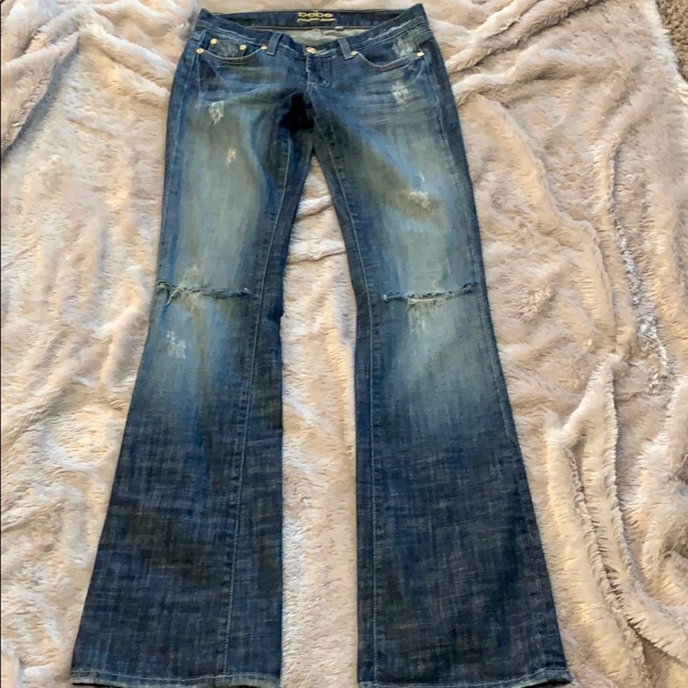 Bebe knee-ripped blue jeans